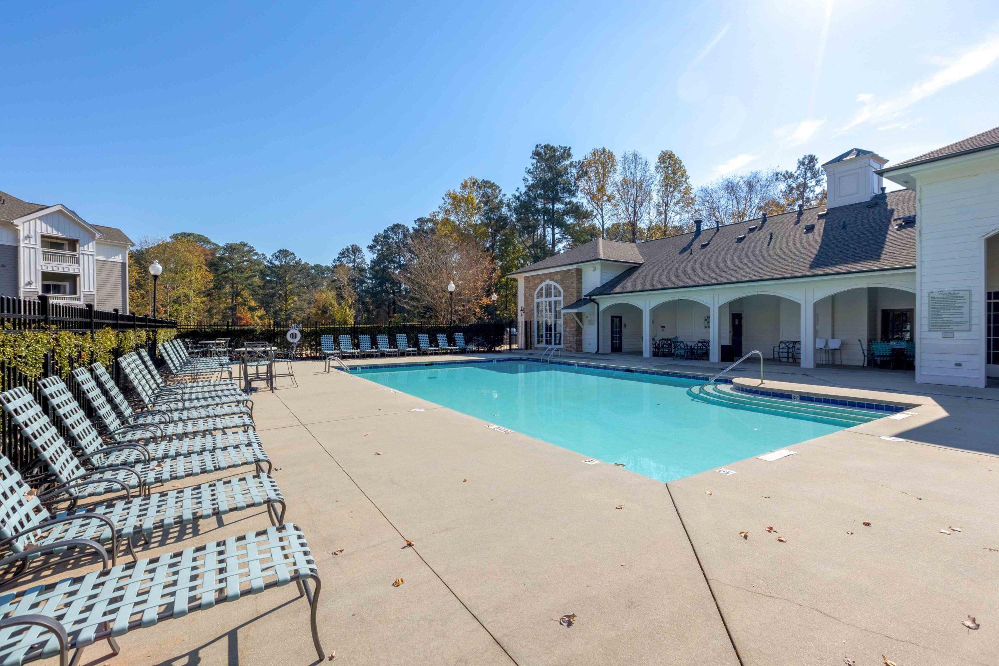 The Greens at Tryon Apartments in Raleigh NC Sparkling Swimming Pool with Lounge Seating